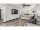 Open-concept living space with wood-look floors and a seamless flow to the dining area at 1700 S Martingale Rd, Gilbert, AZ 85295