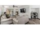 Inviting living room with wood-look floors and a sliding glass door leading to the outdoor space at 1700 S Martingale Rd, Gilbert, AZ 85295