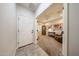 An inviting front foyer that leads into a cozy living room with comfortable furnishings at 17516 W Glenhaven Dr, Goodyear, AZ 85338