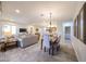 Inviting living space with dining area, cozy seating, and a view of the kitchen at 17516 W Glenhaven Dr, Goodyear, AZ 85338