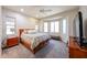 Large bedroom with bay windows, ceiling fan, carpet, and ample natural light at 17516 W Glenhaven Dr, Goodyear, AZ 85338