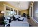 Enclosed patio featuring a ceiling fan, large windows and comfortable seating area at 17516 W Glenhaven Dr, Goodyear, AZ 85338