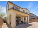 Outdoor patio, complete with a grill and seating area, offers a relaxing space for entertaining at 17721 W Cassia Way, Goodyear, AZ 85338