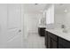 Bathroom showcasing double sink vanity with dark wood cabinets, a large mirror, a shower and tub at 17721 W Cassia Way, Goodyear, AZ 85338