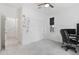Bright bedroom with plush carpeting, white closet doors, and a window with blackout blinds, perfect for work and relaxation at 17721 W Cassia Way, Goodyear, AZ 85338