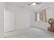 Spacious bedroom with carpet, white walls, two doors, one window, and a playhouse to the side at 17721 W Cassia Way, Goodyear, AZ 85338