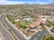 Aerial view of community center with pool and landscaping, offering resort-style amenities at 17721 W Cassia Way, Goodyear, AZ 85338