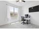 Bright, carpeted home office with natural light, a desk setup, and a wall-mounted television at 17721 W Cassia Way, Goodyear, AZ 85338