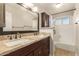 Bathroom featuring double sink vanity with granite counters and shower/tub combo at 1845 N 64Th St, Scottsdale, AZ 85257