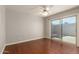 Bedroom featuring wood floors and sliding glass door to the backyard at 1845 N 64Th St, Scottsdale, AZ 85257