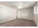 This bedroom has a ceiling fan, plush carpet, and a large closet space at 1845 N 64Th St, Scottsdale, AZ 85257