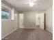 This bedroom offers neutral carpet, a ceiling fan, and lots of closet space at 1845 N 64Th St, Scottsdale, AZ 85257