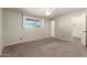 Bright bedroom has a ceiling fan, plush carpet, and a large walk in closet at 1845 N 64Th St, Scottsdale, AZ 85257