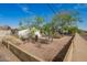 Single-story home with xeriscaping, mature trees, and a block wall at 1845 N 64Th St, Scottsdale, AZ 85257