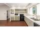 This kitchen has an oven, microwave, dishwasher, and a view of the backyard at 1845 N 64Th St, Scottsdale, AZ 85257