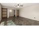 Spacious living room with sliding barn doors, tile floor, and ample natural light at 1845 N 64Th St, Scottsdale, AZ 85257