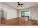 Spacious living room features wood floors, ceiling fan and access to backyard patio at 1845 N 64Th St, Scottsdale, AZ 85257