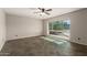 Living room featuring tile flooring, ceiling fan, and a bright window at 1845 N 64Th St, Scottsdale, AZ 85257