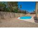 Backyard with lush flowering bushes and private blue pool at 19230 N 5Th St, Phoenix, AZ 85024