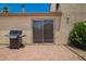 Patio view showcasing grill, sliding glass door, and flowering bushes at 19230 N 5Th St, Phoenix, AZ 85024