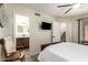 Bedroom leading to an ensuite bath; features a ceiling fan at 19230 N 5Th St, Phoenix, AZ 85024