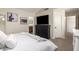 Comfortable bedroom with ceiling fan and view into the ensuite bathroom at 19230 N 5Th St, Phoenix, AZ 85024