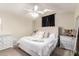 Cozy bedroom featuring a ceiling fan, tufted headboard and neutral color palette at 19230 N 5Th St, Phoenix, AZ 85024