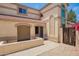 Covered outdoor entry with a blue front door, desert landscaping and an arched entry at 19230 N 5Th St, Phoenix, AZ 85024