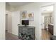Hallway with a display table and a peek into the updated bathroom at 19230 N 5Th St, Phoenix, AZ 85024