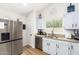 Kitchen with stainless steel appliances and white cabinets at 19230 N 5Th St, Phoenix, AZ 85024