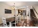 Inviting dining room with wood floors, chandelier, and easy access to the gourmet kitchen, creating a warm and inviting atmosphere at 2470 E Roma Ave, Phoenix, AZ 85016