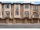 Multi-level townhomes with private garages and charming balcony accents at 2470 E Roma Ave, Phoenix, AZ 85016