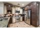 Modern kitchen with granite countertops, stainless steel appliances, and a warm, inviting atmosphere at 2470 E Roma Ave, Phoenix, AZ 85016
