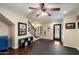 Cozy living area features hardwood floors, a staircase, and a decorative iron door to the outside at 2470 E Roma Ave, Phoenix, AZ 85016