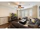 Cozy loft area with plush seating, entertainment center, and shuttered windows, perfect for relaxing and watching television at 2470 E Roma Ave, Phoenix, AZ 85016
