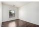 Bright bedroom with a window and modern wood-look flooring; great natural light at 2556 W Amber Sun Dr, Phoenix, AZ 85085