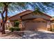Charming single-story home featuring a two-car garage and well-maintained front yard landscaping at 2556 W Amber Sun Dr, Phoenix, AZ 85085