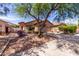 Attractive single-story home with lush landscaping and a wide driveway, perfect for families at 2556 W Amber Sun Dr, Phoenix, AZ 85085