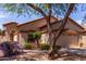 Inviting single-story home with well-kept landscaping and a spacious driveway, offering great curb appeal at 2556 W Amber Sun Dr, Phoenix, AZ 85085