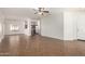 Open-concept living space with tile floors, ceiling fan, and seamlessly connected to the kitchen area at 2556 W Amber Sun Dr, Phoenix, AZ 85085