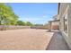 Large, private backyard with desert landscaping and covered patio, perfect for outdoor entertaining at 25726 W Burgess Ln, Buckeye, AZ 85326