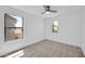 Well lit bedroom showcasing plush carpeting and two windows that bring in natural light at 25726 W Burgess Ln, Buckeye, AZ 85326