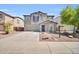 View of the front exterior of the home showing the two car garage at 25726 W Burgess Ln, Buckeye, AZ 85326