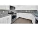 Kitchen featuring granite countertops, stainless steel appliances, and white cabinets at 25726 W Burgess Ln, Buckeye, AZ 85326