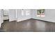 Spacious living room with light gray floors and natural light at 25726 W Burgess Ln, Buckeye, AZ 85326