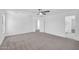 Spacious main bedroom with neutral carpeting and en-suite bathroom at 25726 W Burgess Ln, Buckeye, AZ 85326