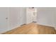 Bright bedroom featuring wood-look floors and access to a bathroom at 2625 E Indian School Rd # 143, Phoenix, AZ 85016