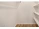 Walk-in closet with built-in shelves for organized storage at 2625 E Indian School Rd # 143, Phoenix, AZ 85016