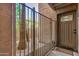 Condo's entry door behind a secure, stylish metal gate for added privacy and security at 2625 E Indian School Rd # 143, Phoenix, AZ 85016