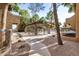 Well-maintained complex exterior with a pool area, pergola, and landscaped walking paths, offering a serene atmosphere at 2625 E Indian School Rd # 143, Phoenix, AZ 85016